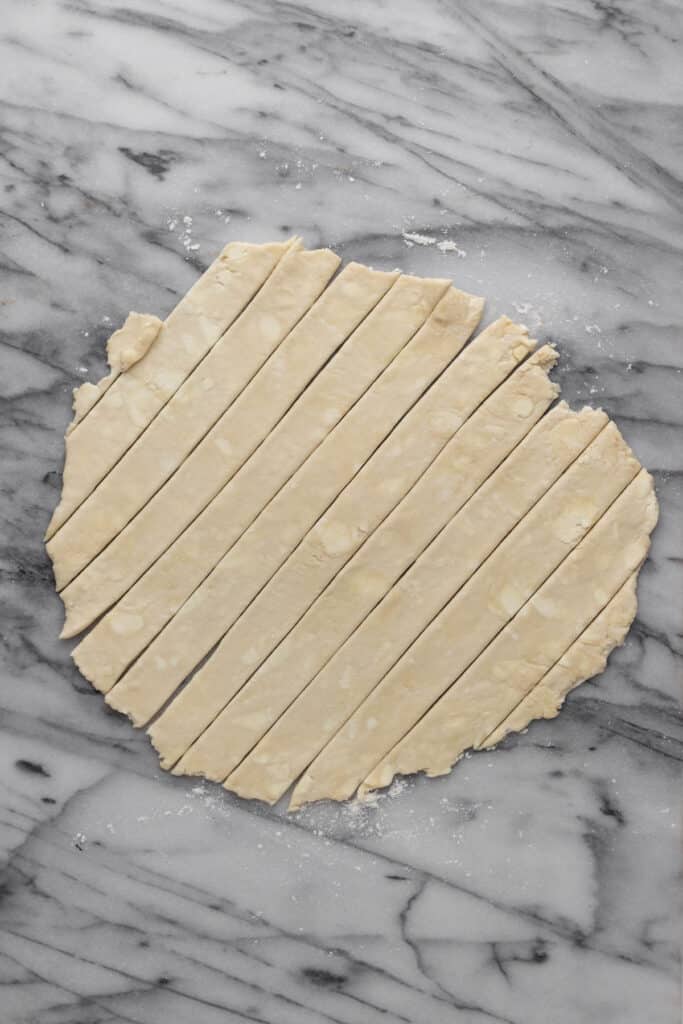 Top pie crust cut into strips for a lattice topped pie.