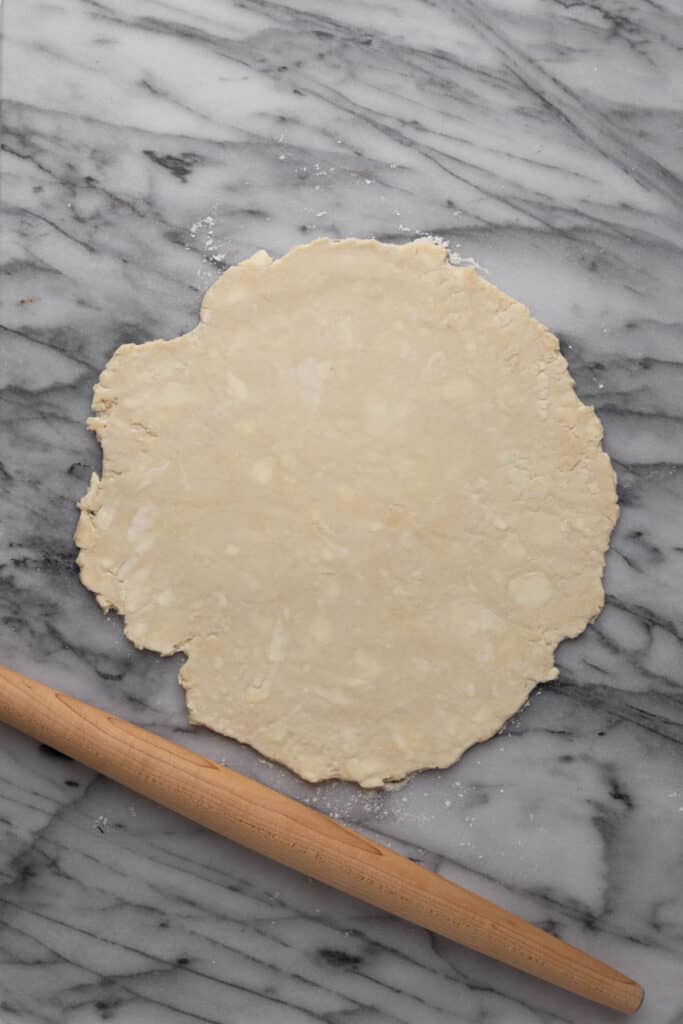 Rolled all-butter pie crust to a thin layer to place into a pie dish.