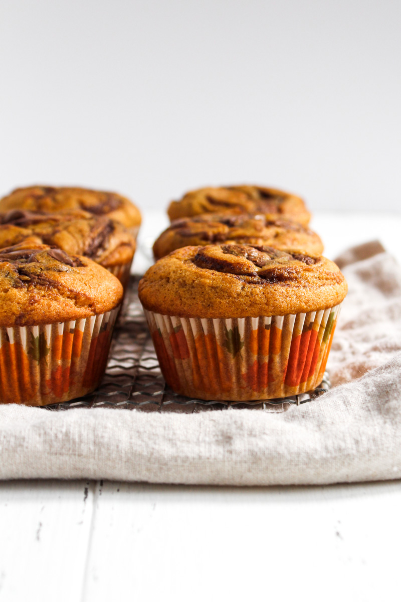 Six pumpkin Nutella muffins on a linen napkin.