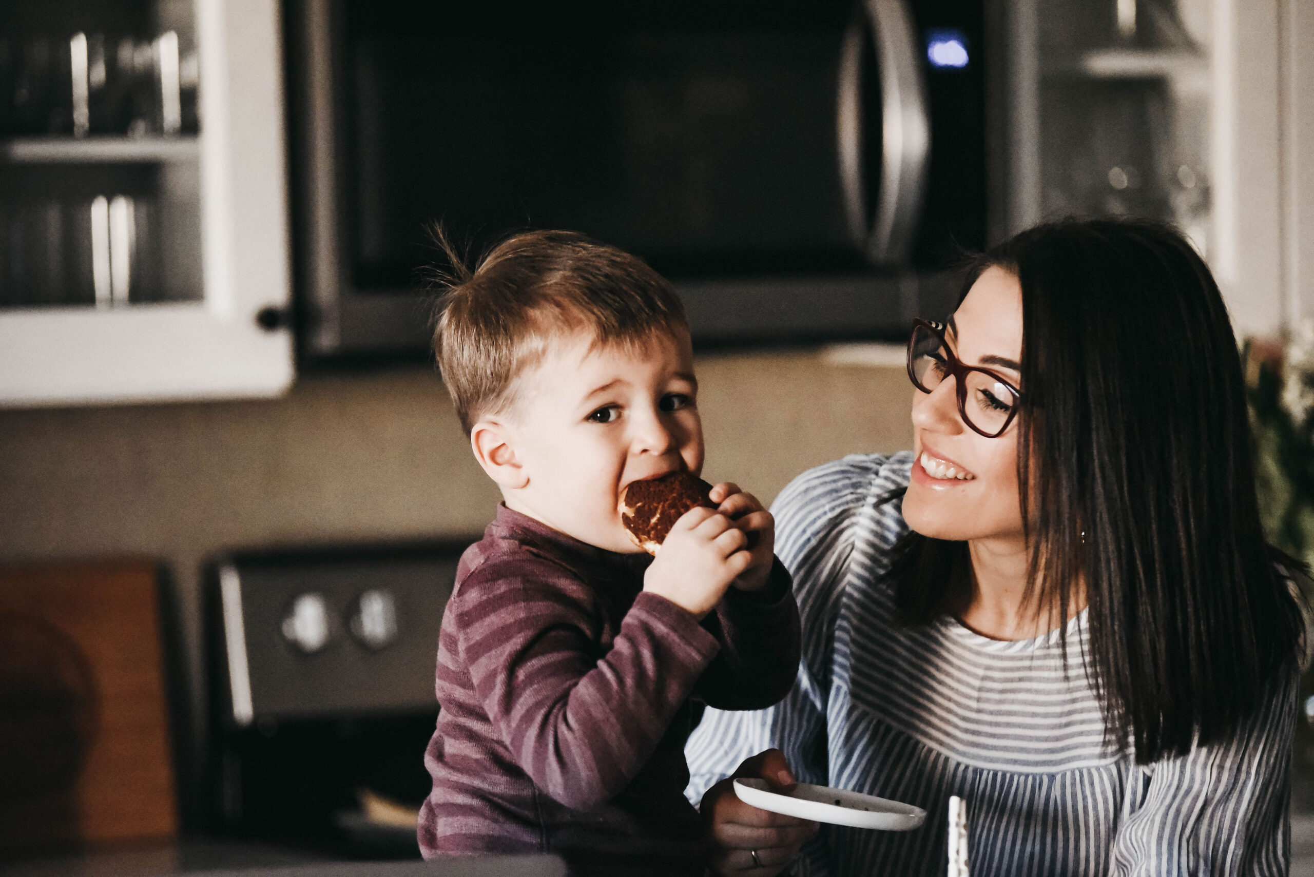 Mom and son baking together