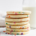 Stack of round funfetti cutout cookies.