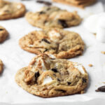 Six S'mores cookies on parchment paper