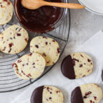 Cranberry orange shortbread cookies dipped in chocolate.