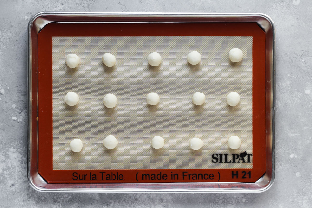 Sheet pan for round teaspoonfuls of buttercream for stuffing cookies.