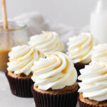 Sweet potato cupcakes with salted maple caramel cream cheese frosting and a caramel drizzle.