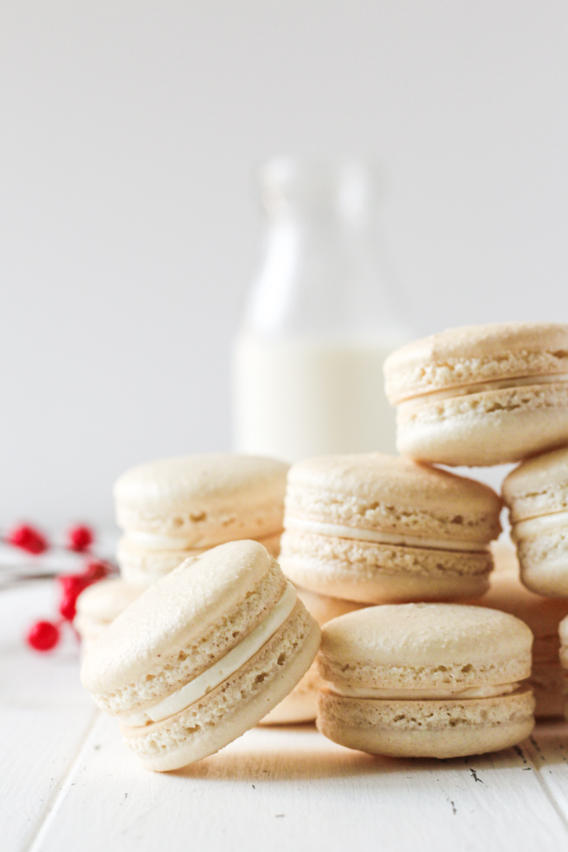 Stack of white chocolate cranberry macarons.