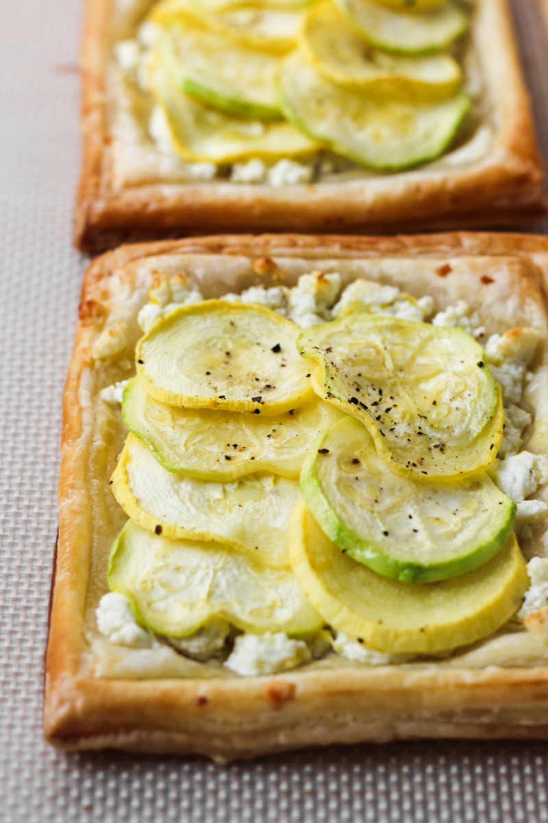 Baked puff pastry with feta, zucchini and yellow squash tarts.