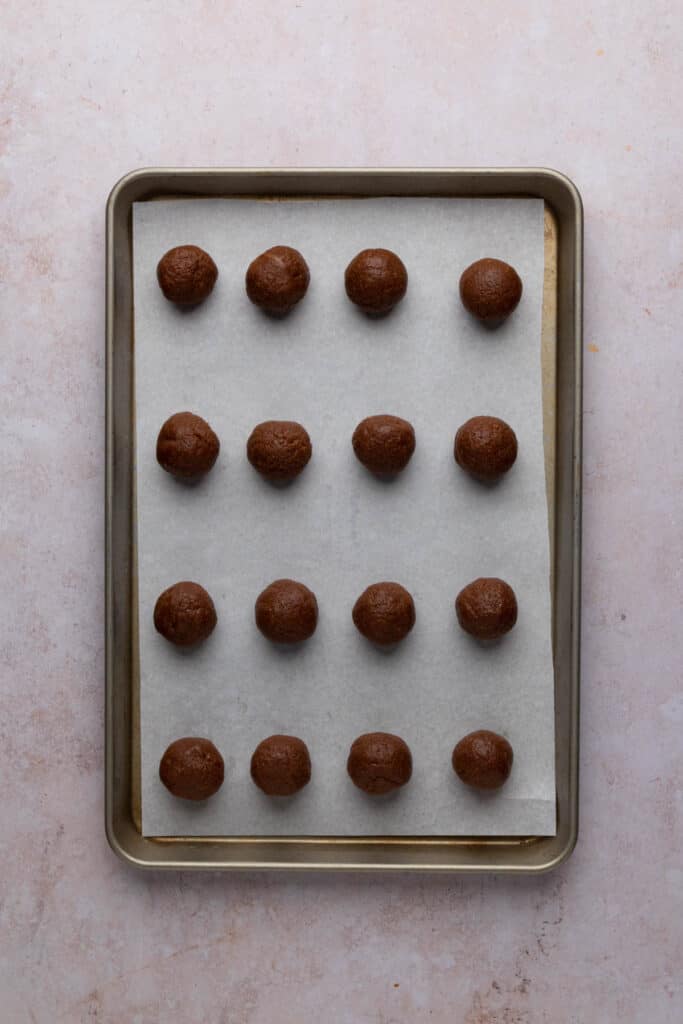 Biscoff cookie butter truffles on a sheet pan without the coating.