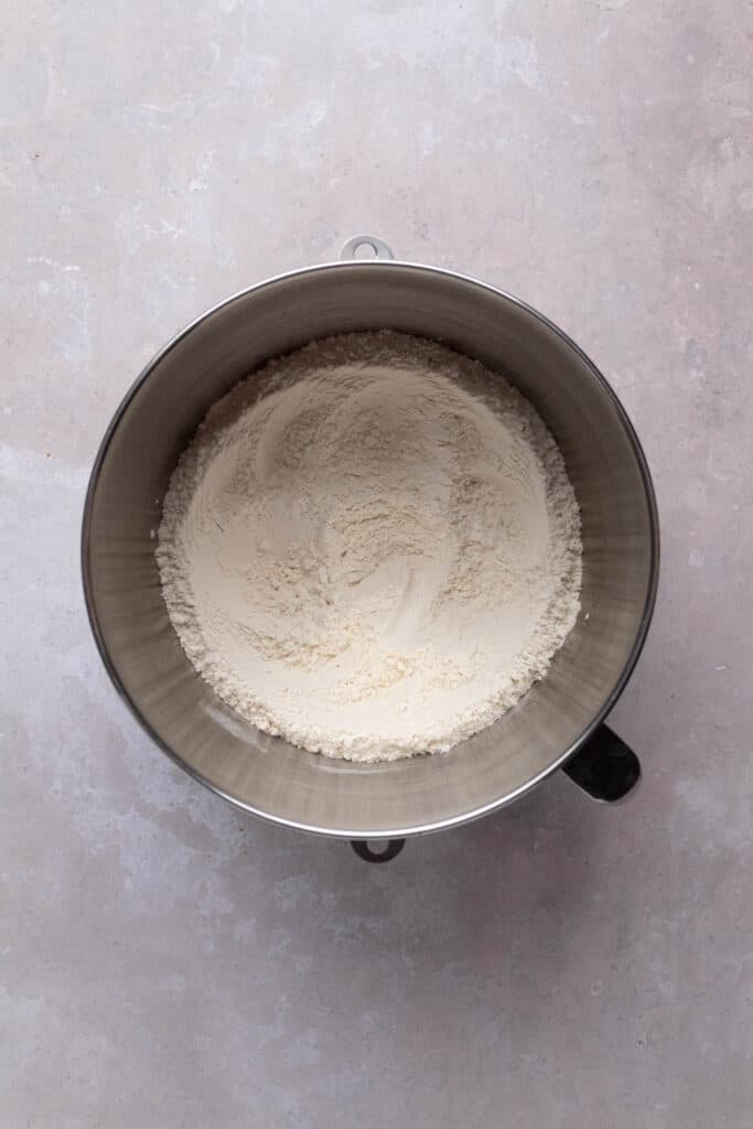 Whisked dry ingredients in a mixing bowl for brioche donuts.