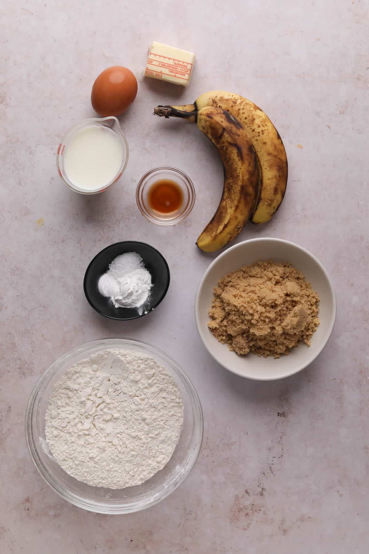 Ingredients for baked banana donuts in bowls.