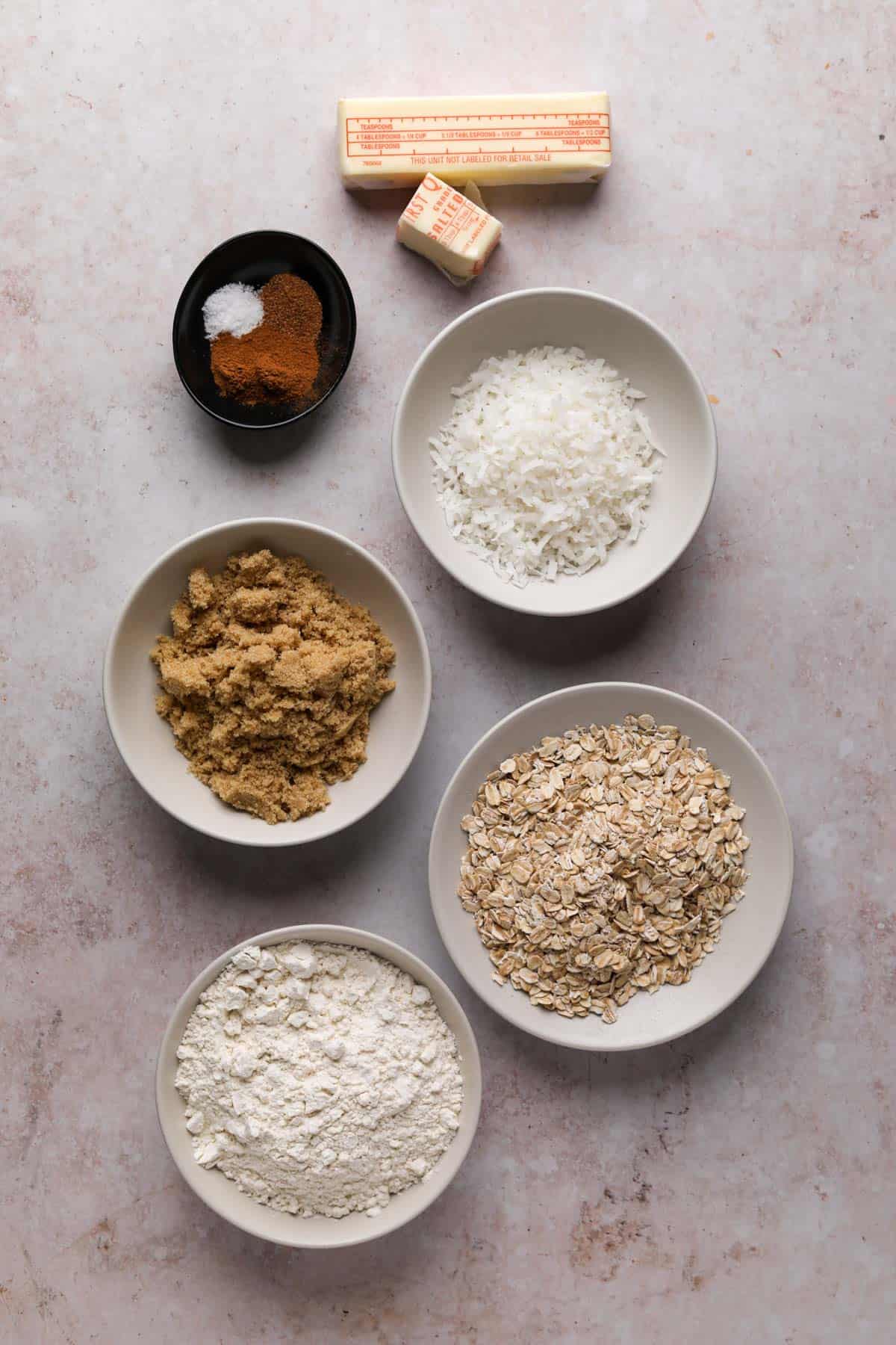 Peach cherry crisp topping ingredients in bowls.