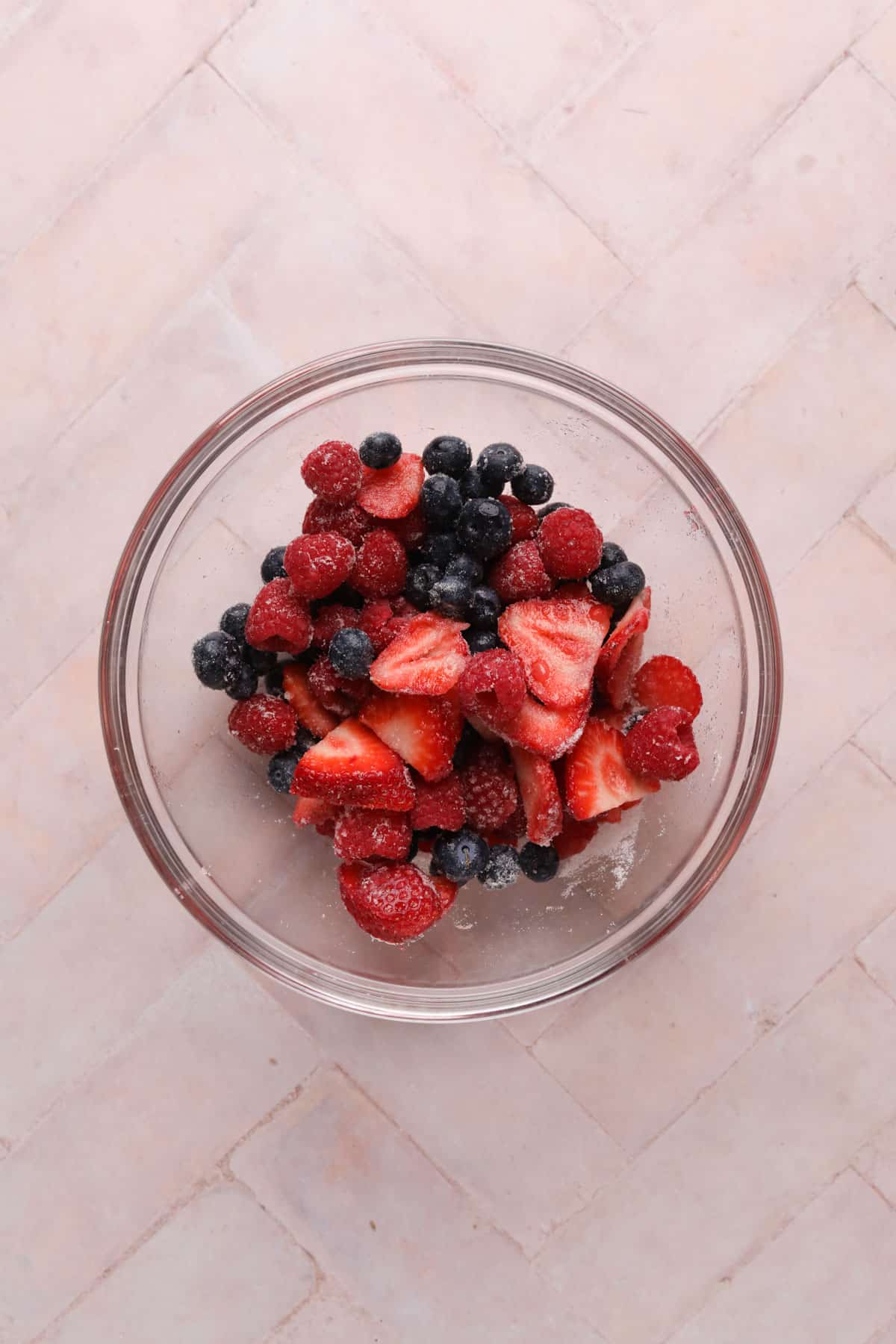 Macerated berries in a glass bowl.