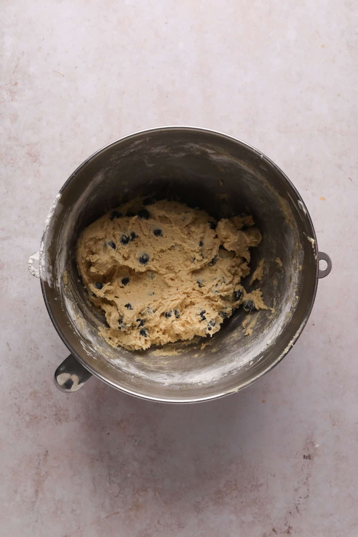 Lemon blueberry cookie dough in a stand mixer bowl.