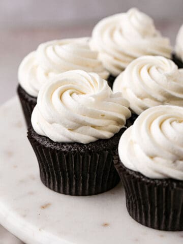 Chocolate cupcakes frosted with homemade cream cheese frosting.