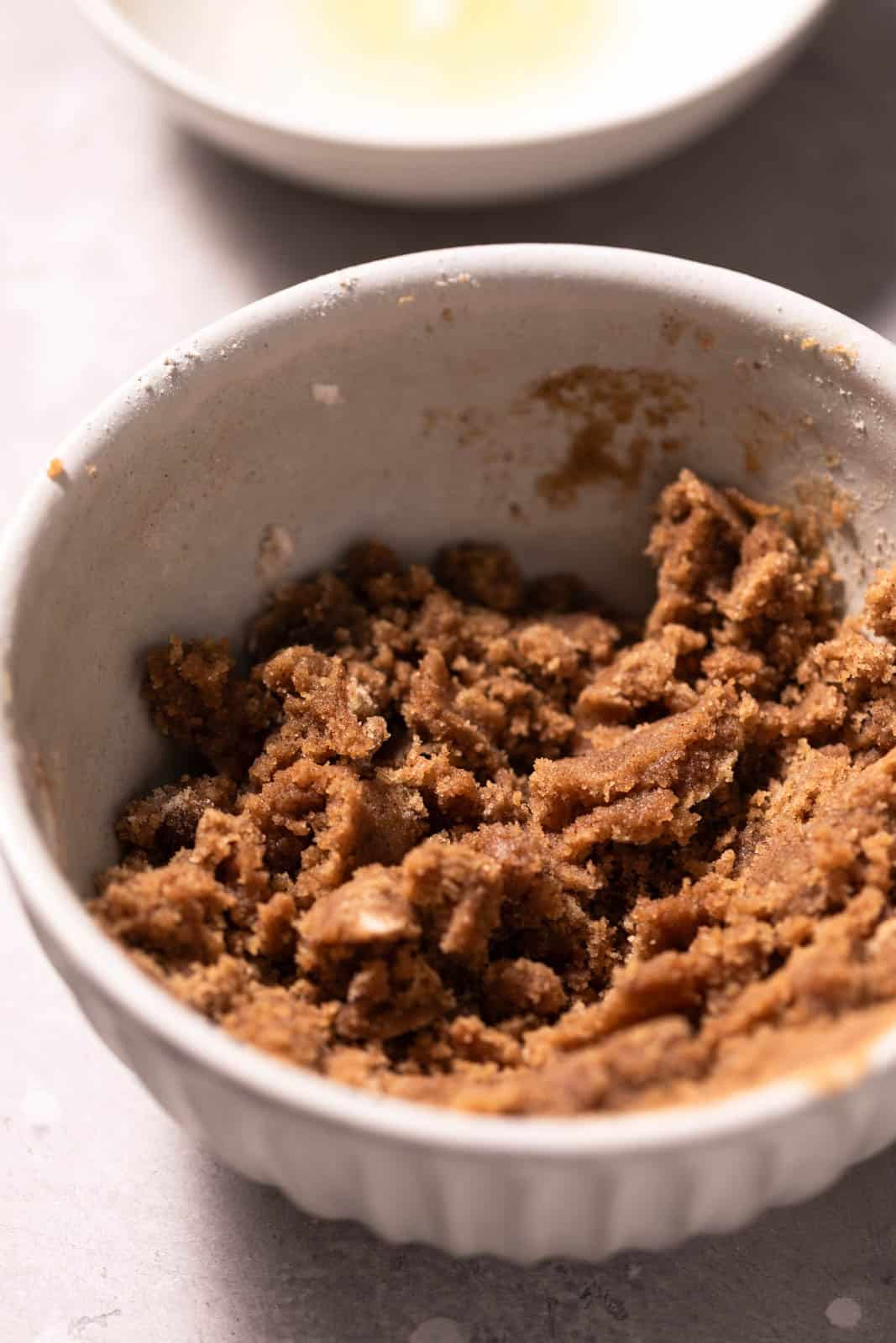 Brown sugar crumble mixed in a small ceramic bowl.