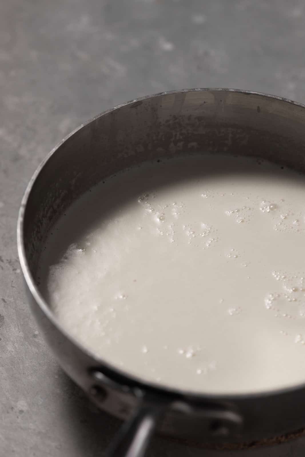 Milk and cream simmering in a sauepan.